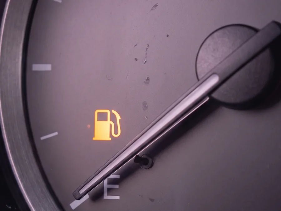 Fuel gauge needle on empty with warning light on